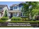 Charming two-story home featuring stone accents, a covered porch, and professionally landscaped front yard at 5451 W 73Rd Ave, Westminster, CO 80003