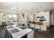 Bright living space with a dining area, a modern kitchen featuring a central island, and a cozy seating area at 5451 W 73Rd Ave, Westminster, CO 80003