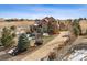 Desirable home with a well-maintained driveway, mature trees, and manicured landscaping at 5582 Twilight Way, Parker, CO 80134