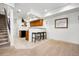 Finished basement featuring a kitchenette with a breakfast bar, carpeted floors, and a staircase at 5582 Twilight Way, Parker, CO 80134