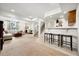 Finished basement with a kitchenette, seating area, dining area, and staircase at 5582 Twilight Way, Parker, CO 80134