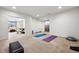 Finished basement with room for recreation, and a living/dining space in the background at 5582 Twilight Way, Parker, CO 80134