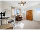 Bedroom featuring desk, comfortable sitting chair, large wardrobe, and natural light at 5582 Twilight Way, Parker, CO 80134