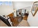 Beautiful entryway with staircase leading to a living room with large windows and plenty of natural light at 5582 Twilight Way, Parker, CO 80134