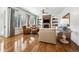 Inviting living room with hardwood floors, fireplace, and large windows that provide abundant natural light at 5582 Twilight Way, Parker, CO 80134