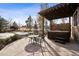 Outdoor living space featuring a hot tub, pergola, and fire pit, perfect for entertaining at 5582 Twilight Way, Parker, CO 80134