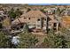 Stunning home featuring a tile roof, stone accents, and an outdoor deck perfect for entertaining at 5582 Twilight Way, Parker, CO 80134