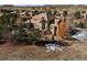 Expansive home with a beautifully landscaped yard, multiple decks, and serene outdoor living spaces at 5582 Twilight Way, Parker, CO 80134