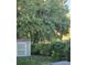 Private backyard with a shed surrounded by trees, offering a serene space at 19357 E 40Th Ave, Denver, CO 80249