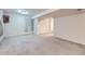 Spacious basement featuring neutral carpet, a window for natural light and closet for storage at 19357 E 40Th Ave, Denver, CO 80249