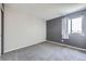 This bedroom features plush carpeting, neutral walls, and a bright window at 19357 E 40Th Ave, Denver, CO 80249