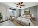 Serene bedroom with soft lighting, a ceiling fan, a window and neutral color accents at 19357 E 40Th Ave, Denver, CO 80249