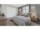 Well-lit bedroom with large window, soft light, and a calming color palette at 19357 E 40Th Ave, Denver, CO 80249
