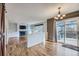 Open dining room featuring a sliding glass door and views into the living room at 19357 E 40Th Ave, Denver, CO 80249