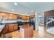 Kitchen with wood cabinets, stainless steel appliances, and center island at 19357 E 40Th Ave, Denver, CO 80249