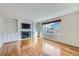 Living room with a fireplace, built-in shelving, and large windows at 19357 E 40Th Ave, Denver, CO 80249