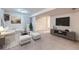 A cozy living room with neutral colors, soft textures, and ample natural light, perfect for relaxation at 19357 E 40Th Ave, Denver, CO 80249