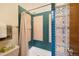 Bathroom with tile shower, glass block partition and updated fixtures in a well-lit space at 7226 S Eagles Nest Cir, Littleton, CO 80127