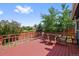 Spacious wood deck with outdoor table and seating, ideal for entertaining or enjoying peaceful outdoor meals at 7226 S Eagles Nest Cir, Littleton, CO 80127