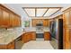 Modern kitchen with stainless steel appliances, granite countertops, and custom cabinets at 7226 S Eagles Nest Cir, Littleton, CO 80127