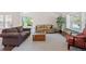 Comfortable living room showcasing neutral decor, a large window, and plenty of natural light at 7226 S Eagles Nest Cir, Littleton, CO 80127