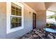 Outdoor balcony features a neutral outdoor rug, seating and large window view at 2301 E Fremont Ave # W08, Centennial, CO 80122