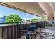 Relax on this cozy outdoor balcony with a nice floral rug and seating and scenic view at 2301 E Fremont Ave # W08, Centennial, CO 80122