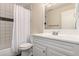 Bright bathroom features a shower-tub combo with white tiled walls and a white vanity at 2301 E Fremont Ave # W08, Centennial, CO 80122