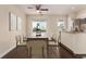 Bright dining room features hardwood floors, a modern ceiling fan, and plenty of natural light from the large window at 2301 E Fremont Ave # W08, Centennial, CO 80122
