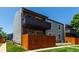 Building exterior showing a balcony, fence, and lawn at 2301 E Fremont Ave # W08, Centennial, CO 80122