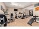 Well-equipped gym has treadmills, bikes, and a weight training machine at 2301 E Fremont Ave # W08, Centennial, CO 80122