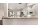 Bright kitchen with white cabinets, granite countertops, and stainless steel appliances at 2301 E Fremont Ave # W08, Centennial, CO 80122