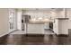 Modern kitchen features stainless steel appliances, granite countertops, and white cabinets at 2301 E Fremont Ave # W08, Centennial, CO 80122