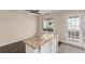 Kitchen and living room combo featuring granite countertops and stainless steel appliances at 2301 E Fremont Ave # W08, Centennial, CO 80122