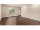 Open living room with wood floors, lots of natural light, and easy access to the outside at 2301 E Fremont Ave # W08, Centennial, CO 80122