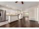 Open concept living area features modern kitchen and wood floors, great for entertaining at 2301 E Fremont Ave # W08, Centennial, CO 80122