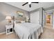 Comfortable bedroom with plush carpeting, a decorative painting, and a spacious closet, offering a serene retreat at 5778 S Duquesne Ct, Aurora, CO 80016