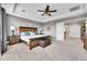 Bright bedroom features tray ceiling, carpet, fan, wood furniture, and stylish decorations at 5778 S Duquesne Ct, Aurora, CO 80016