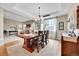 Elegant dining room with a chandelier, and wood table for formal gatherings at 5778 S Duquesne Ct, Aurora, CO 80016