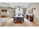 Inviting dining room with a chandelier, large table, and a decorative buffet at 5778 S Duquesne Ct, Aurora, CO 80016