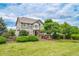 Charming two-story home with a well-maintained lawn, mature trees, and a fenced backyard, perfect for Gathering living at 5778 S Duquesne Ct, Aurora, CO 80016