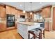 Stylish kitchen featuring granite countertops, an island, and modern stainless steel appliances at 5778 S Duquesne Ct, Aurora, CO 80016