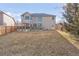 Large backyard featuring a deck, well-maintained lawn, and privacy fence at 17101 W 64Th Dr, Arvada, CO 80007