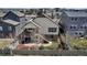 Home featuring a backyard with a large deck, beautiful landscaping, a stone walkway and a fenced yard at 4032 Donnington Cir, Castle Rock, CO 80104