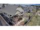 Home featuring a backyard with a large deck, beautiful landscaping, a stone walkway and a fenced yard at 4032 Donnington Cir, Castle Rock, CO 80104