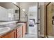Bathroom featuring double sink and open view to bedroom at 4032 Donnington Cir, Castle Rock, CO 80104