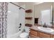 Bathroom featuring shower, toilet, sink, and wicker storage at 4032 Donnington Cir, Castle Rock, CO 80104
