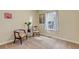 Bright bedroom features carpeted floors, a window, and two chairs at 4032 Donnington Cir, Castle Rock, CO 80104