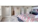 Bedroom view featuring comfortable bed, bathroom entrance, and closet at 4032 Donnington Cir, Castle Rock, CO 80104