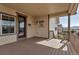 Cozy covered deck with wood flooring and view at 4032 Donnington Cir, Castle Rock, CO 80104